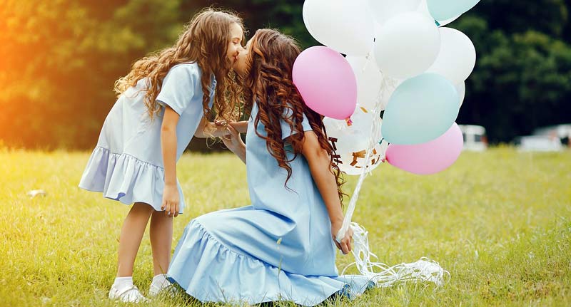 Moms and Daughters Look-Alike Dresses In View Of Fashion Trend